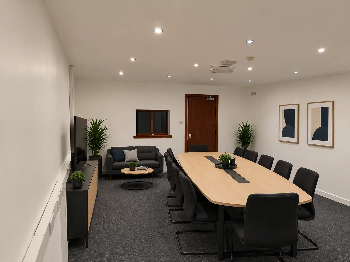 River House boardroom with meeting table, lounge seating and television