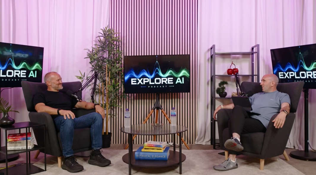 The Studio at River House: host and guest mid-recording in armchairs with microphones